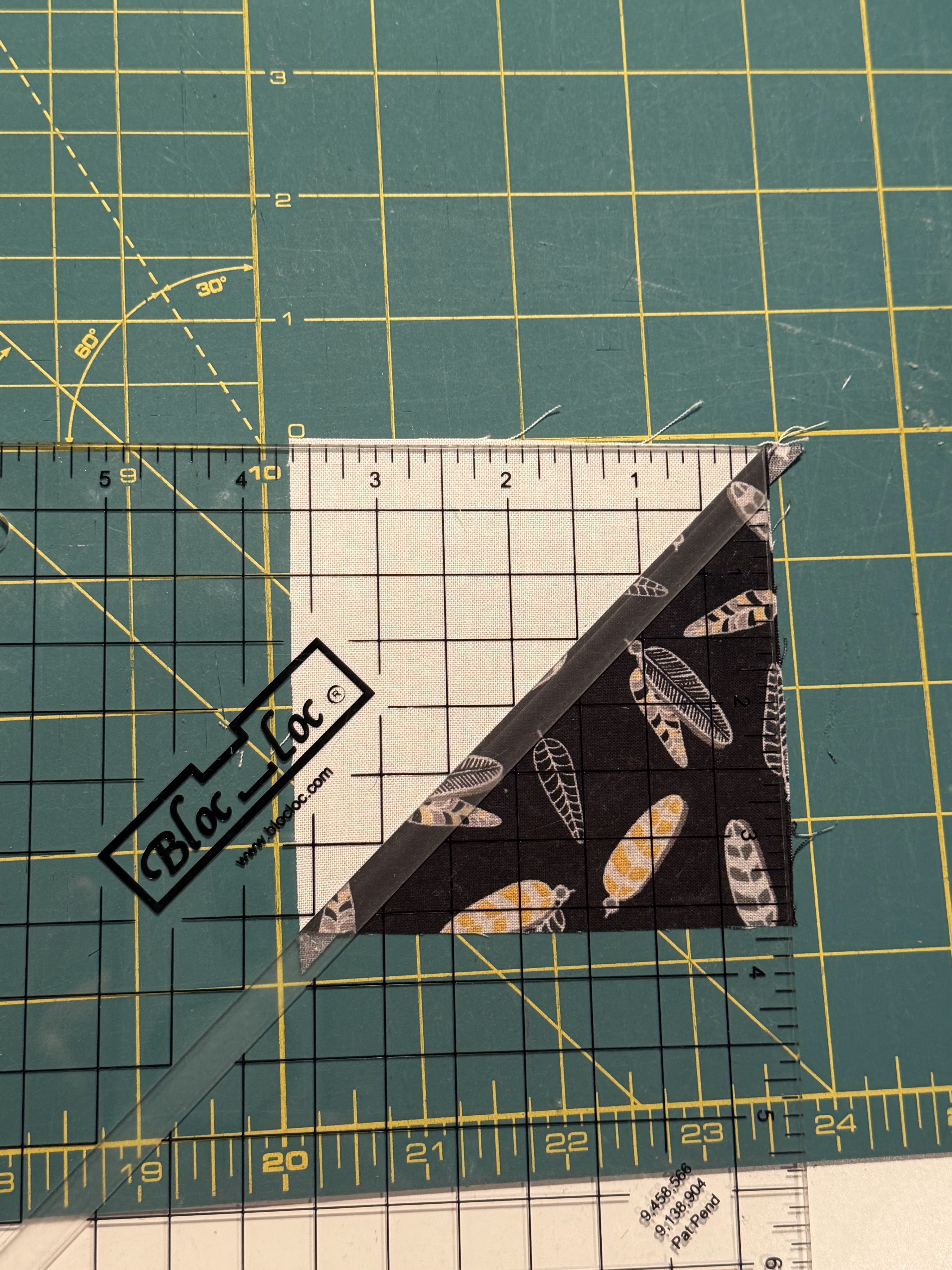 Bloc_loc ruler on top of fabric.